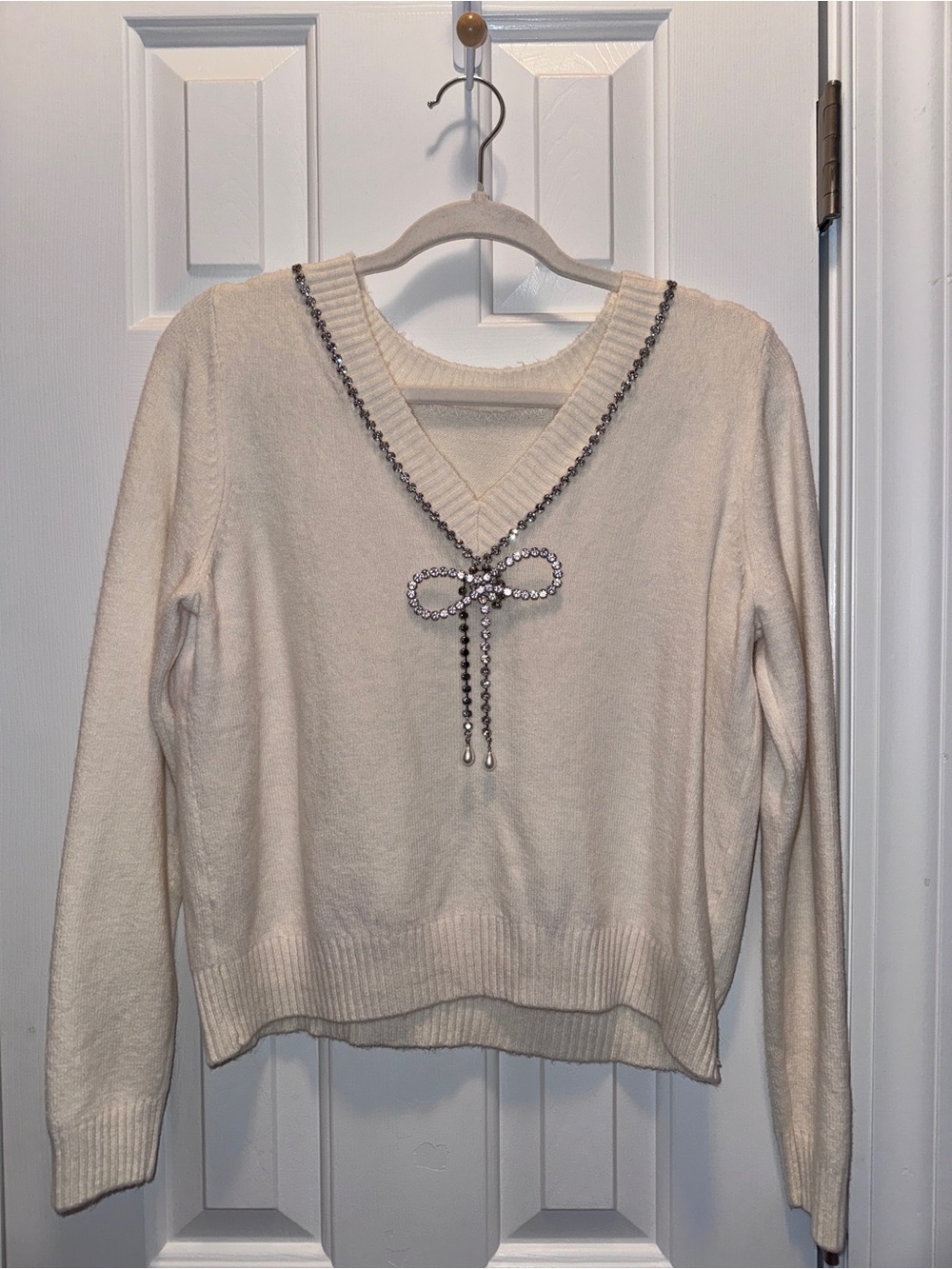 LOFT Cream V-Neck Sweater with Rhinestone Bow Trim never worn